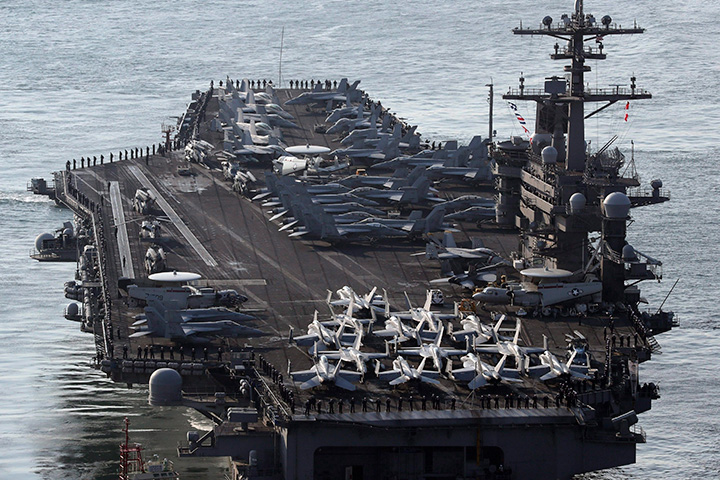 In this March 15, 2017 file photo, U.S. Navy aircraft carrier, the USS Carl Vinson approaches to participate in the annual joint military exercise called Foal Eagle between South Korea and the United States, at Busan port in Busan, South Korea.