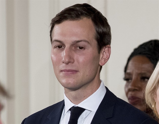 In this Jan. 22, 2017, file photo, President Donald Trump's White House Senior Adviser Jared Kushner watches as President Donald Trump, left, congratulates other White House senior staff during a swearing in ceremony in the East Room of the White House in Washington. 