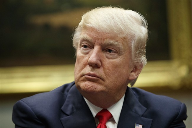  In this Friday, March 31, 2017 file photo, President Donald Trump listens during a meeting with the National Association of Manufacturers in the Roosevelt Room of the White House in Washington. 