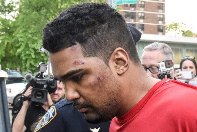 Richard Rojas is escorted from the 7th precinct by New York City Police officers after being processed in connection with the speeding vehicle that struck pedestrians on a sidewalk in Times Square, May 18, 2017.