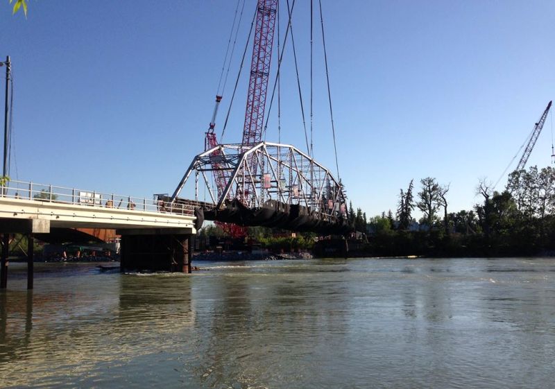 Crews work to remove the Zoo Bridge on 12 Street S.E. on Monday, May 29, 2017. 