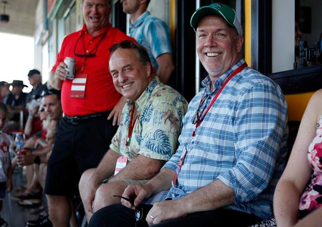 BC Green Leader Andrew Weaver pictured at a rugby match with Premier John Horgan in the days before the pair signed a power sharing deal.