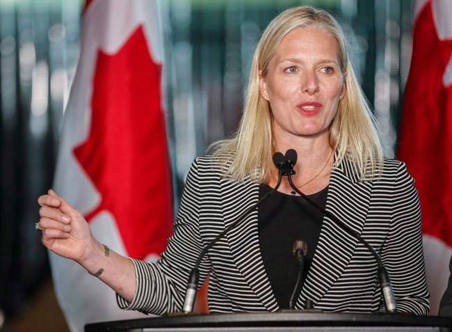 The federal government says Manitoba and Saskatchewan won't get their share of a new compensation fund unless they sign on to the national climate change accord by the end of the year.