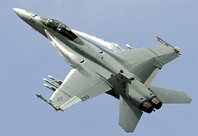 A Boeing F-18 Super Hornet performs during its demonstration flight, on the first day of the 47th Paris Air Show in Le Bourget, north of Paris.