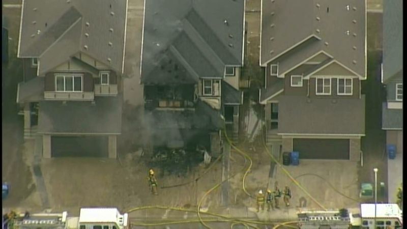 Calgary firefighters battle a blaze along Savanna Grove N.E. on Tuesday, May 23, 2017.