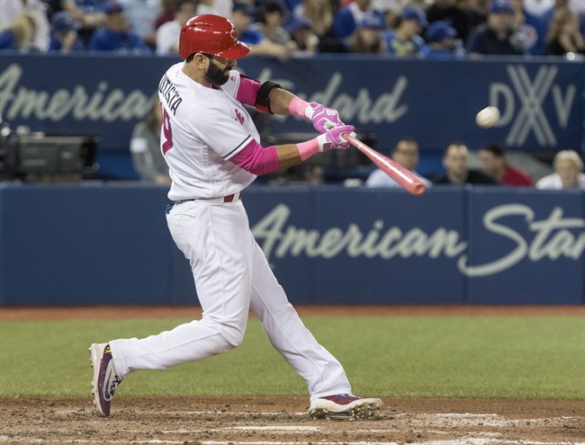 Toronto Blue Jays' Jose Bautista connects on a three-run home run against the Seattle Mariners in the seventh inning of their AL baseball game in Toronto on Saturday, May 13, 2017.