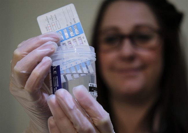 A technician tests a sample at SureHire, an Edmonton-based drug testing company with branches across Canada, in Calgary, Alta., Wednesday, April 26, 2017.