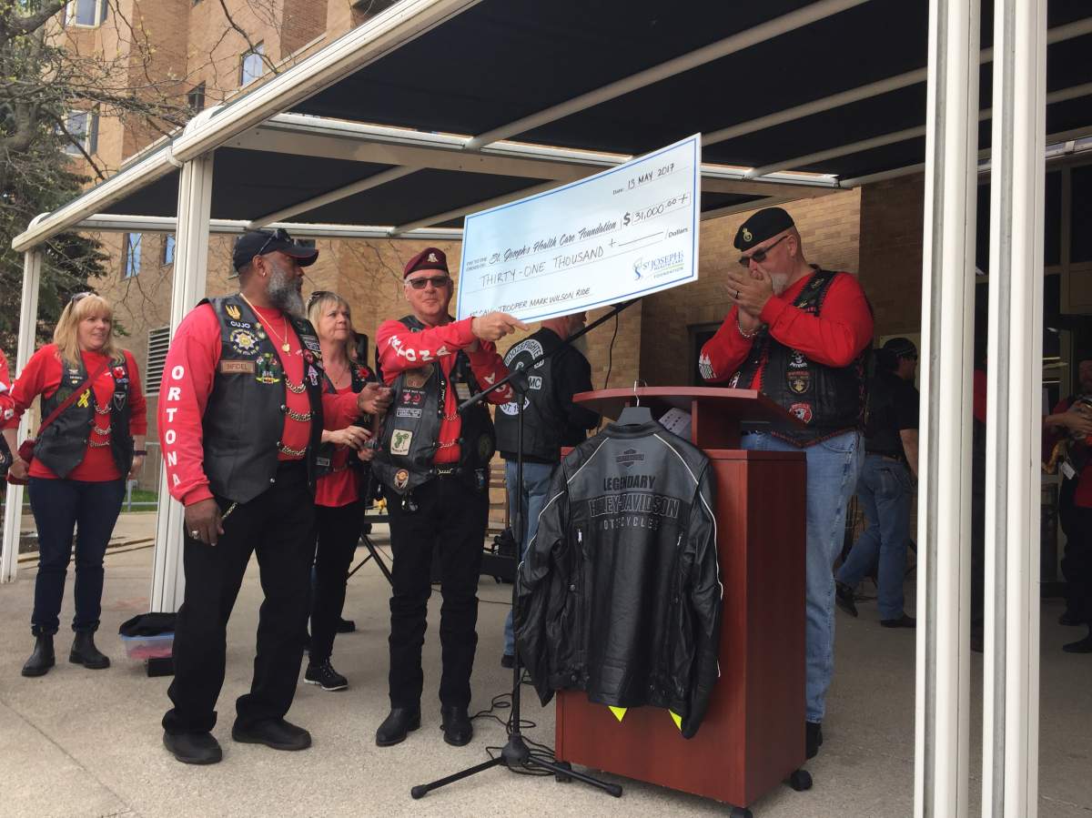 Members of the 1st Canadian Army Veterans motorcycle unit present a cheque to St. Joseph's Health Care Foundation on May, 13, 2017.