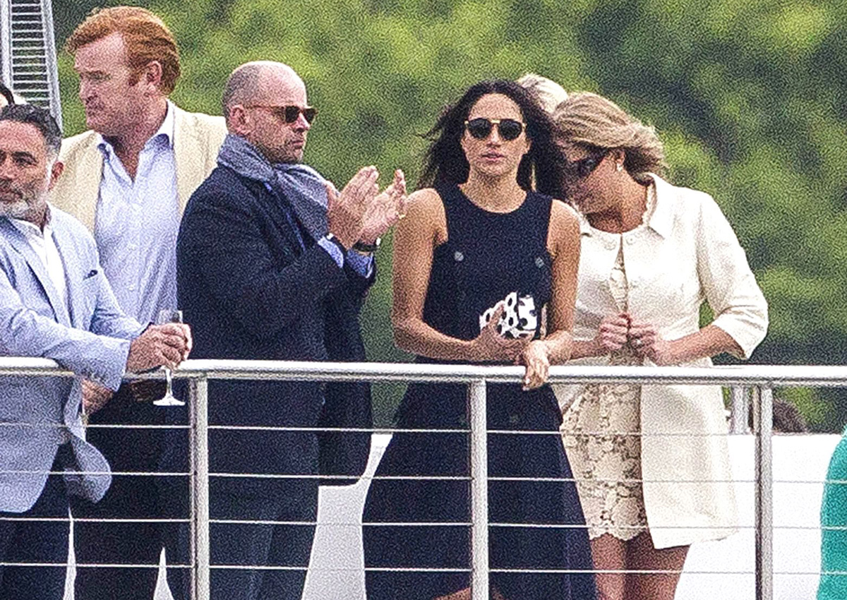 Meghan Markle watches Prince Harry during the presentations at the Audi Polo Challenge.