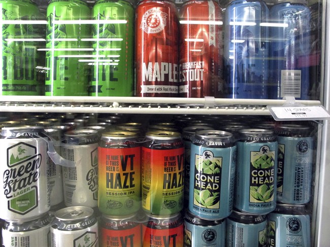 Different varieties of Vermont craft beer sit in a store cooler at Mehuron's Market on Tuesday, May 9, 2017,.
