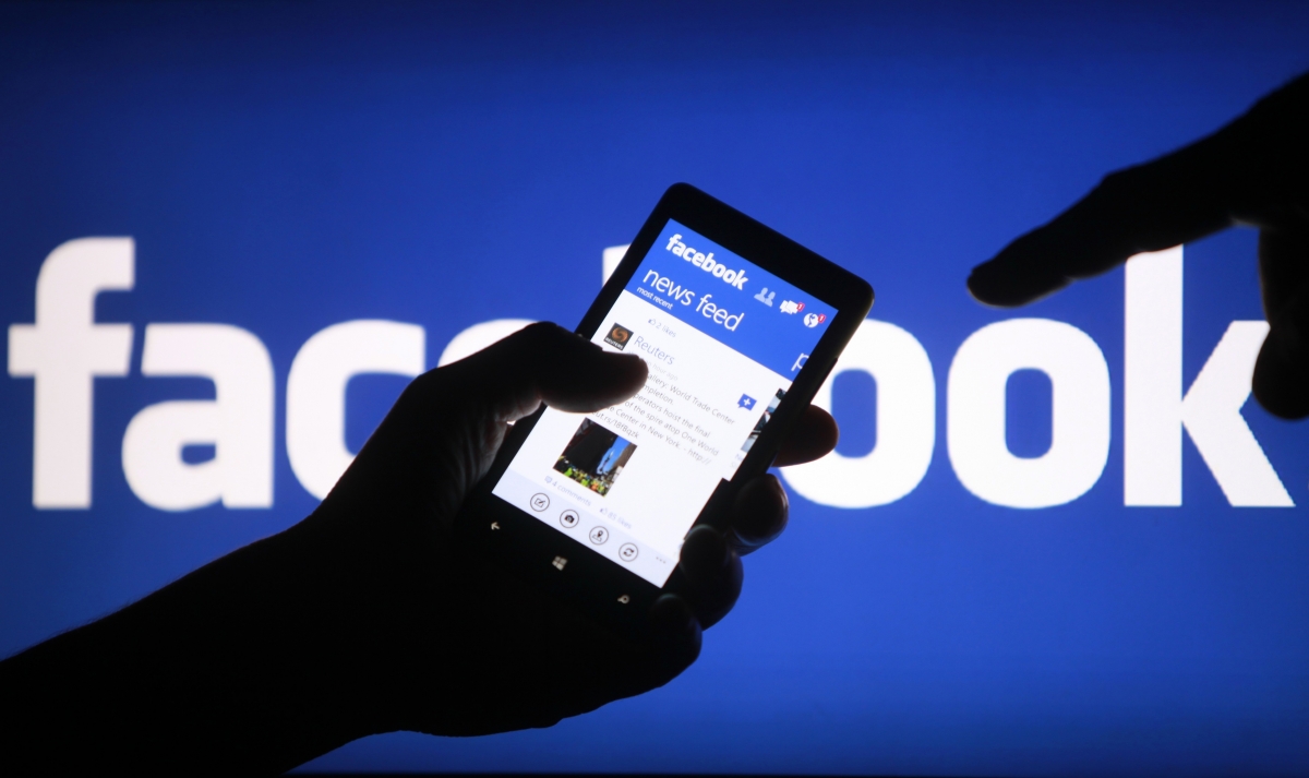 Stock image of Facebook on a cell phone. 