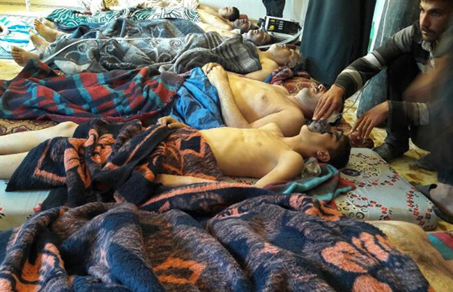  In this April 4, 2017 file photo, victims of a suspected chemical weapons attack lie on the ground, in Khan Sheikhoun, in the northern province of Idlib, Syria. 