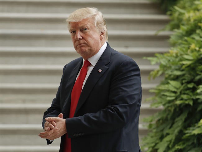 President Donald Trump walks back into the White House in Washington, Wednesday, June 7, 2017, following his arrival on Marine One helicopter.