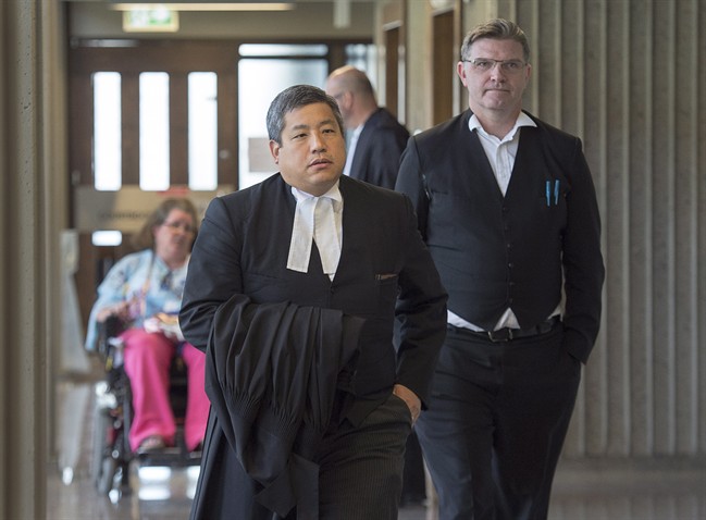 William Sandeson’s defence team, Brad Sarson (right) and Eugene Tan (foreground) attend Nova Scotia Supreme Court in Halifax on June 16, 2017. (Andrew Vaughan/Canadian Press)