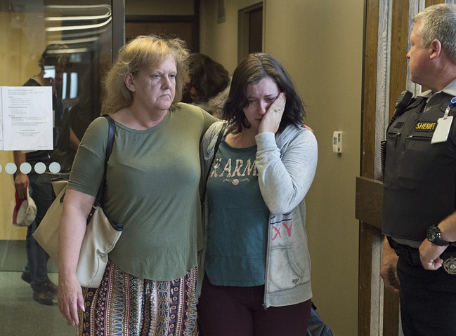 Taylor Samson’s mother, Linda Boutilier (left) and family friend Anne-Marie Anstey head from the courtroom at the murder trial of William Sandeson at Nova Scotia Supreme Court in Halifax on June 18, 2017. (Andrew Vaughan/Canadian Press)