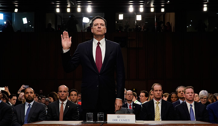 Former FBI Director James Comey is sworn in prior to testifying before a Senate Intelligence Committee hearing on Russia’s alleged interference in the 2016 U.S. presidential election on Capitol Hill in Washington, June 8, 2017.