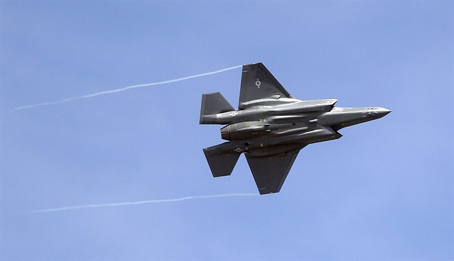 In this Wednesday, Sept. 2, 2015, file photo, an F-35 jet arrives at its new operational base at Hill Air Force Base, in northern Utah.