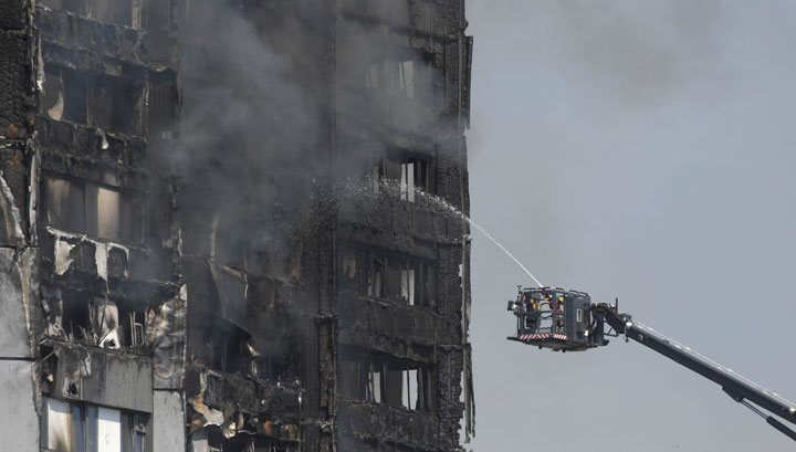 Firefighters battle a blaze at an apartment tower in London.