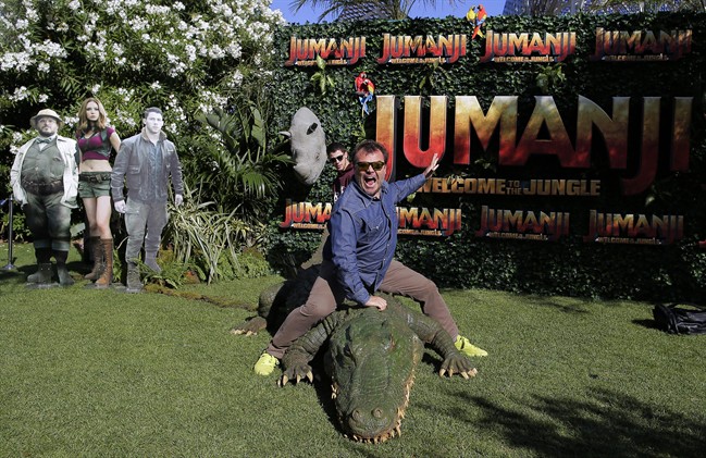 Actors Jack Black, right, and Nick Jonas pose to the media during a photocall to promote the film "Jumanji: Welcome to the jungle" in Barcelona, Spain, Sunday, June 18, 2017. 