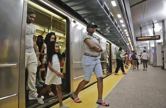Passengers leave the No. 1 train at the South Ferry Station in New York City. A Canadian has pleaded guilty to plotting an attack on the city.