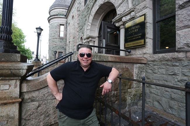Gemma Hickey stands on the steps of the Supreme Court in St. John's NL on Friday on June 23 2017. Hickey a transgender activist vying for a non-binary birth certificate is taking legal action against the Newfoundland and Labrador government as part of a crusade to have genders other than male and female formally recognized.