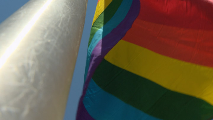 Rainbow flag raising at city hall to mark the official kick off of the Saskatoon Pride Festival also honours victims of Orlando nightclub shooting.