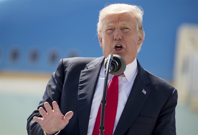  In this June 13, 2017, photo, President Donald Trump speaks in front of Air Force One in Milwaukee, Wis. 