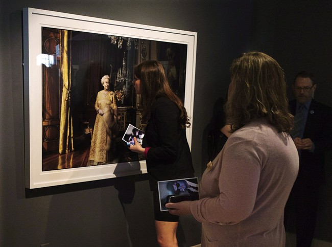 A photo of Queen Elizabeth is viewed as a collection of artwork by famed American photographer Annie Leibovitz is donated to the Art Gallery of Nova Scotia in Halifax on Thursday, June 6, 2013. Four years after the country's largest collection of photographs by famed American artist Annie Leibovitz was donated to the Art Gallery of Nova Scotia, the images of celebrity and pop culture icons remain in storage.