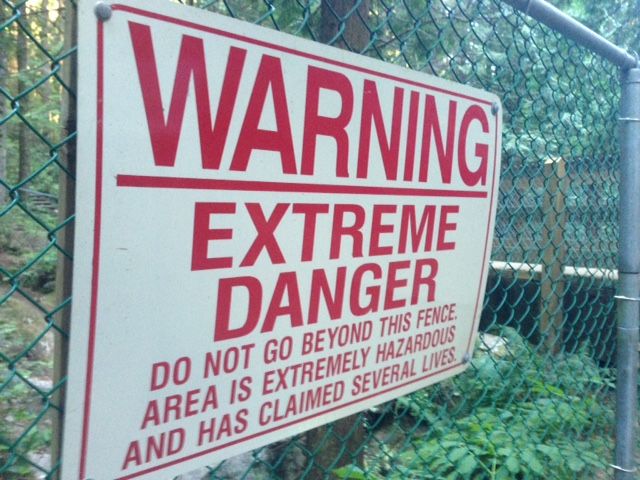 A sign warning of extreme danger at Twin Falls in North Vancouver’s Lynn Canyon.