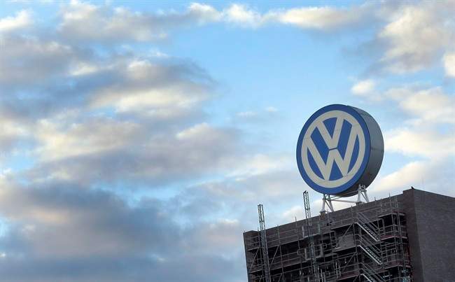In this Sept. 26, 2015 file photo a giant logo of the German car manufacturer Volkswagen is pictured on top of a company's factory building in Wolfsburg, Germany.