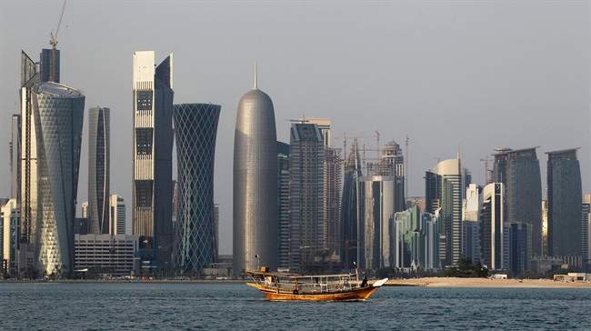 A traditional dhow floats in the Corniche Bay of Doha, Qatar.