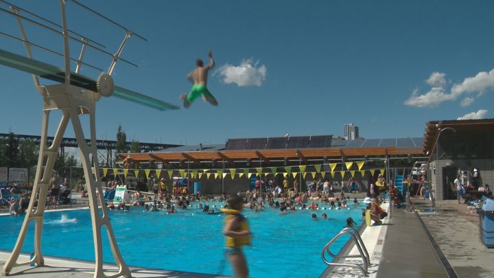 People enjoy the sun and water at Queen Elizabeth Outdoor Pool Tuesday, July 4, 2017.