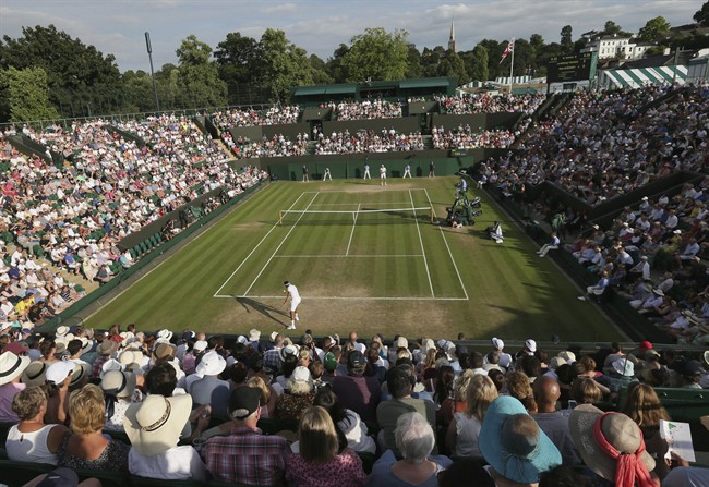 Jo‚ÄîWilfried Tsonga of France returns to Sam Querrey of the United States during their Men's Singles Match on day five at the Wimbledon Tennis Championships in London Friday, July 7, 2017.