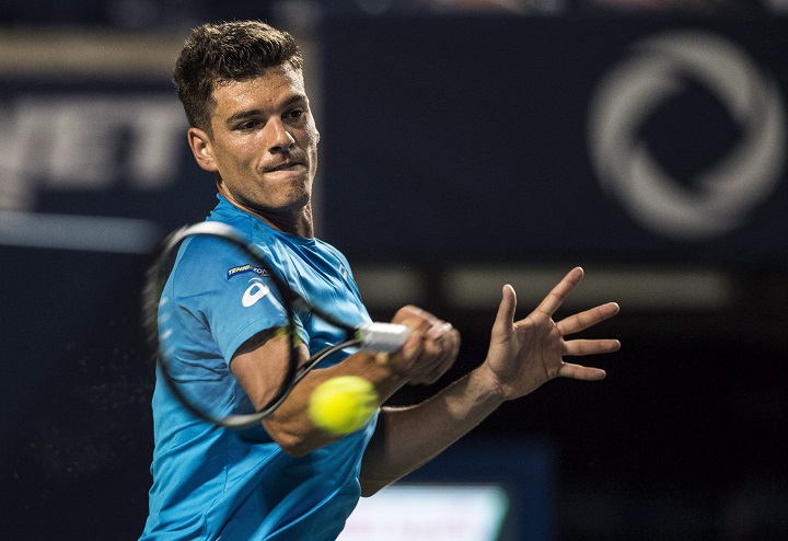 In this 2016 file photo, Frank Dancevic, of Canada, returns to Sam Querrey, of the United States, during men's first round Rogers Cup tennis action in Toronto On Sunday, . Dancevic failed to advance to the
Rogers Cup main draw at Montreal's Uniprix Stadium. Sunday, Aug. 6, 2017.