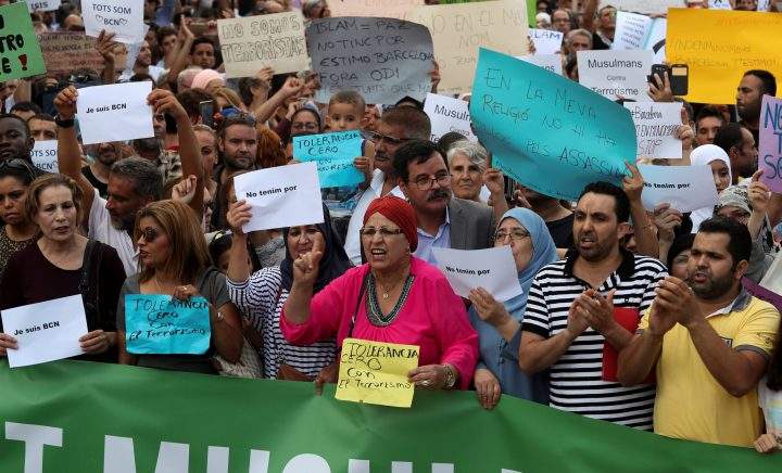Muslims shout slogans as they gather at Plaza Catalunya to protest against terrorism in Barcelona, Aug. 2.