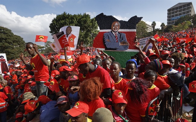 A supporter holds a painting of Kenya’s President Uhuru Kenyatta at an election rally in Uhuru Park in downtown Nairobi, Kenya Friday, Aug. 4, 2017.