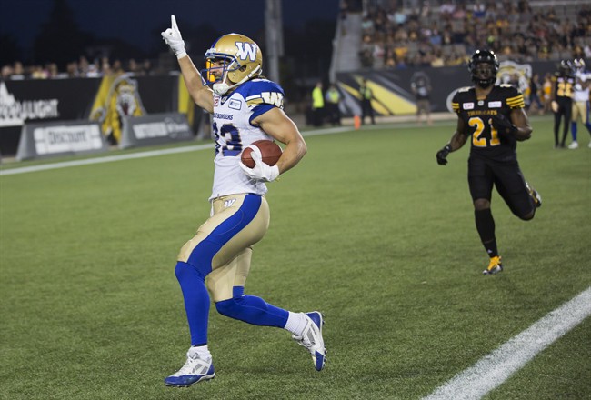 Winnipeg Blue Bombers receiver Julian Feoli-Gudino crosses the goal line to score a touchdown against the Hamilton Tiger-Cats.
