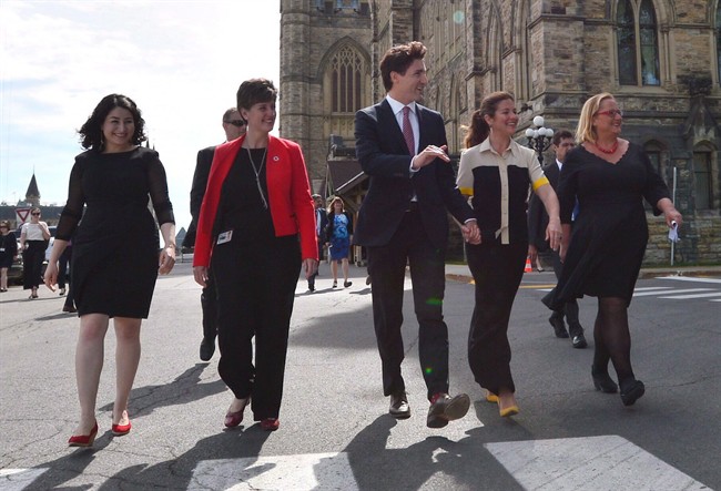 Status of Women Minister Maryam Monsef, left to right, Minister of International Development and La Francophonie Marie-Claude Bibeau, Prime Minister Justin Trudeau, Sophie Gregoire Trudeau and Women Deliver President and CEO Katja Iversen arrive at an event in Ottawa on Tuesday, June 13, 2017. The Liberal government is thinking about using its massive purchasing power to support women in business. 