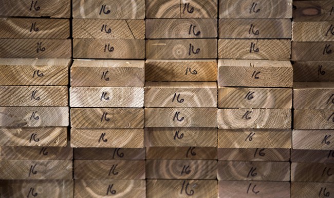 Cedar planks are stacked at a lumber yard, Tuesday, April 25, 2017 in Montreal.