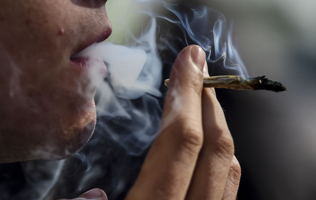 Someone smoking a joint.