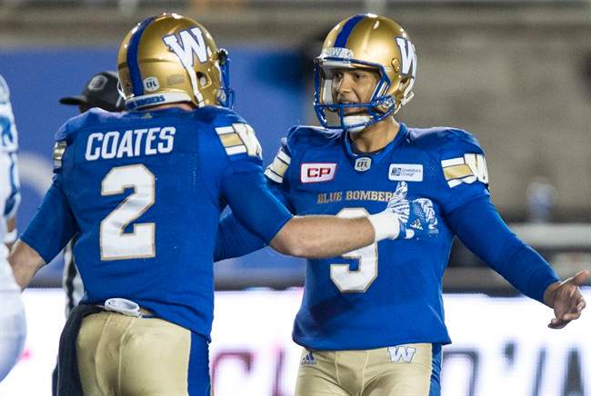 Matt Coates congratulates Justin Medlock on his game winning field goal Thursday.