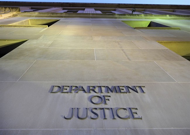 FILE - In this May 14, 2013 file photo, the Justice Department headquarters building in Washington. 