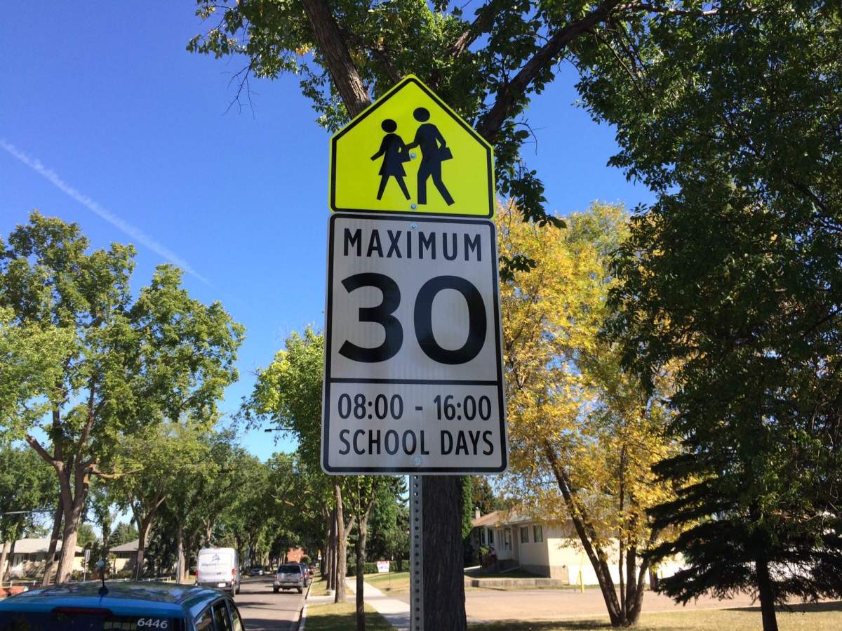School zone speed limit signs read 8 – 4 p.m. outside St. Mark’s Junior High School in Edmonton near 116 Avenue and 135 Street. Sept. 4, 2017.