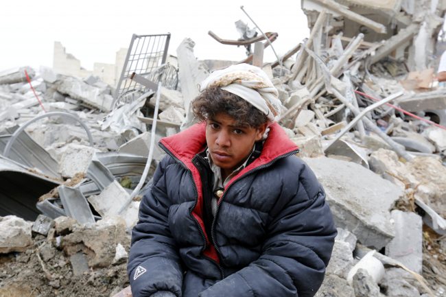 A Yemeni sits on debris of his relatives building allegedly hit by a Saudi-led airstrike in Sanaa, Yemen, 25 August 2017.