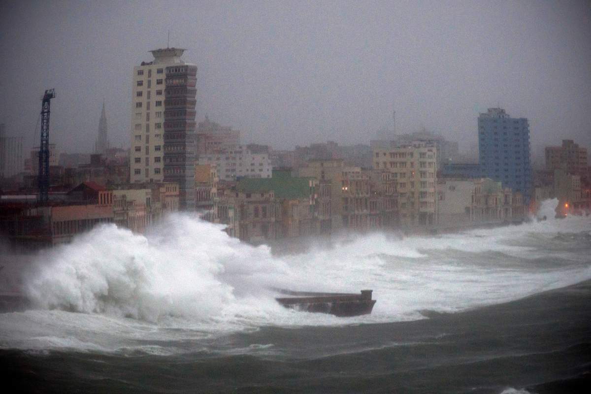 heavy waves overwhelm a shoreline