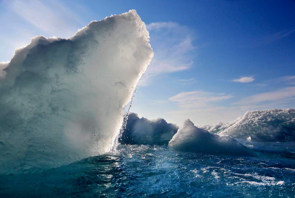 FILE – In this July 21, 2017, file photo, broken sea ice emerges from under the hull of the Finnish icebreaker MSV Nordica as it sails through the Victoria Strait while traversing the Arctic’s Northwest Passage.