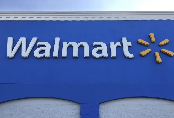 This Thursday, Jan. 5, 2017, photo shows corporate signage at a Walmart in Kissimmee, Fla. 