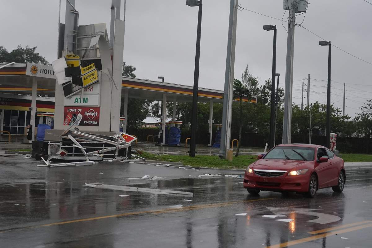 A gas station sign lays destroyed after Hurricane Irma blew though Fort Lauderdale, Florida, September 10.