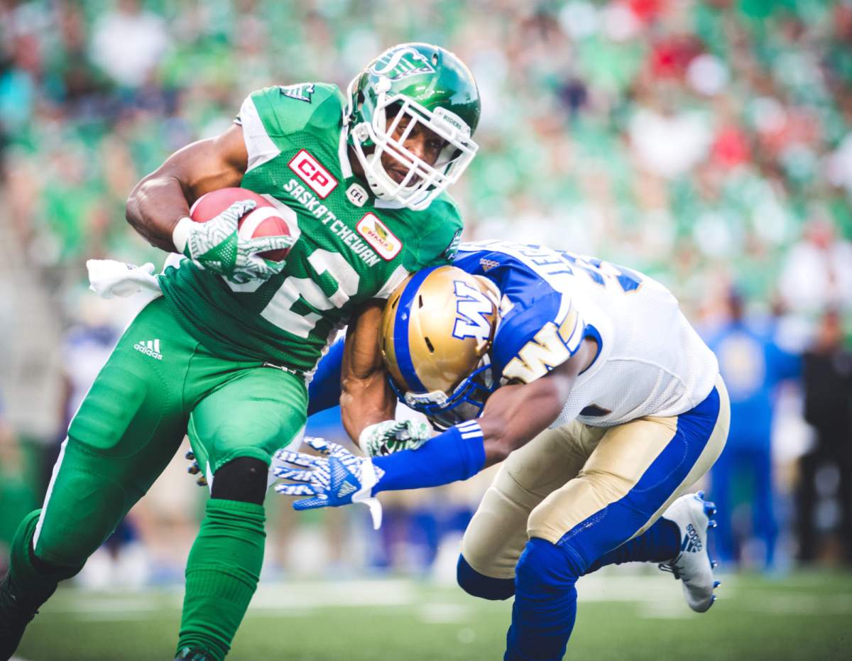 Cameron Marshall (32) of the Saskatchewan Roughriders and Maurice Leggett (31) of the Winnipeg Blue Bombers during the game at New Mosaic Stadium in Regina, SK, Saturday, July 1st, 2017. (Photo: Johany Jutras)
