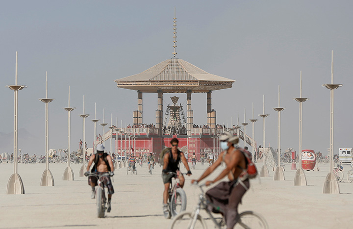 Participants explore the playa at the Burning Man arts and music festival in the Black Rock Desert of Nevada, August 28, 2017.